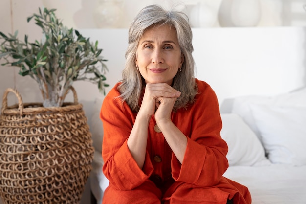 Portrait of senior woman wearing red shirt